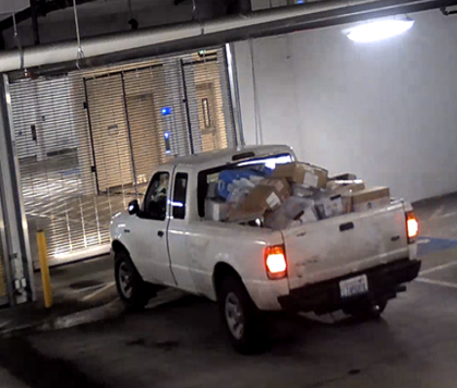Wick's white pickup truck with merchandise in the truck bed