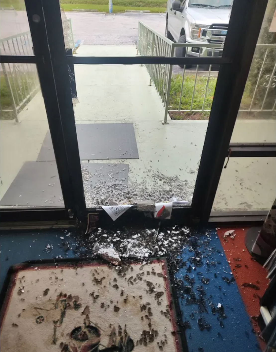 Smashed glass door at Decks & Dice Tournament Center