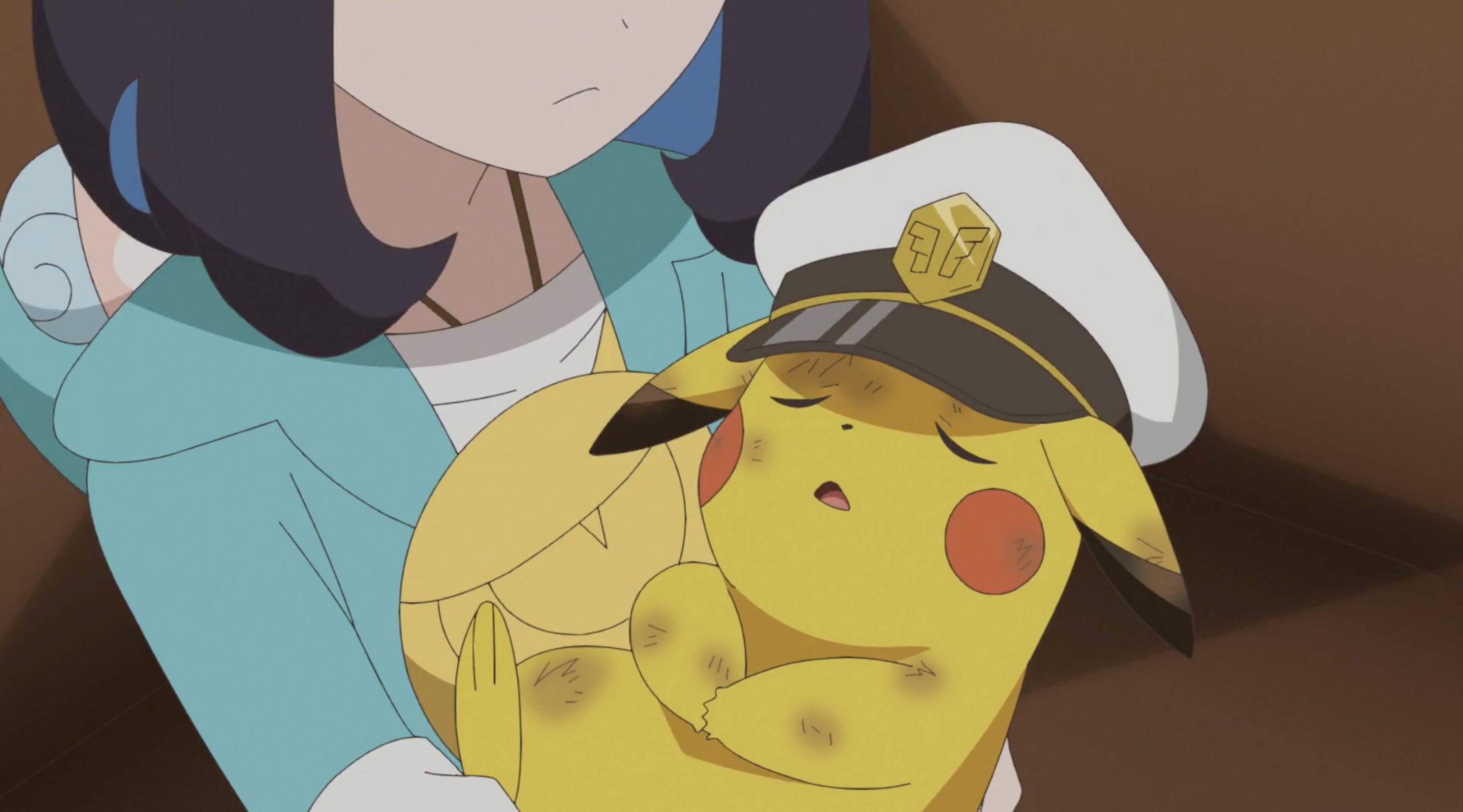 Liko cradling a battered and bruised Captain Pikachu